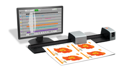 X Rite IntelliTrax2 automated scanning solution measuring a press sheet, with MeasureColor Production software displayed on the monitor to support closed-loop automation in offset printing.