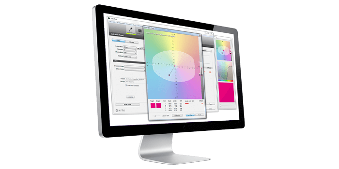A large desktop computer showing X-Rite color analysis software ColorCert Desktop Tools.